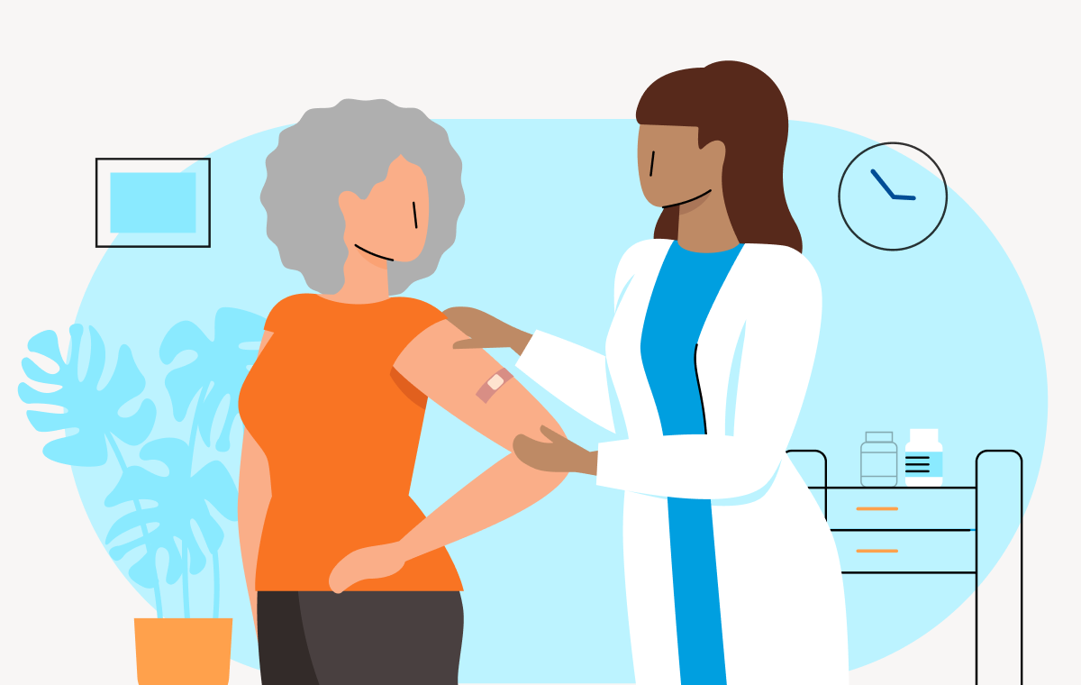 woman pharmacist holding woman's vaccinated left hand with band-aid