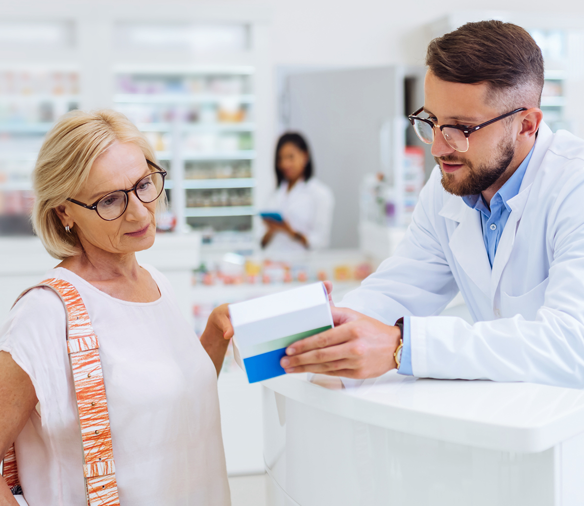 Pharmacist explaining medication to customer
